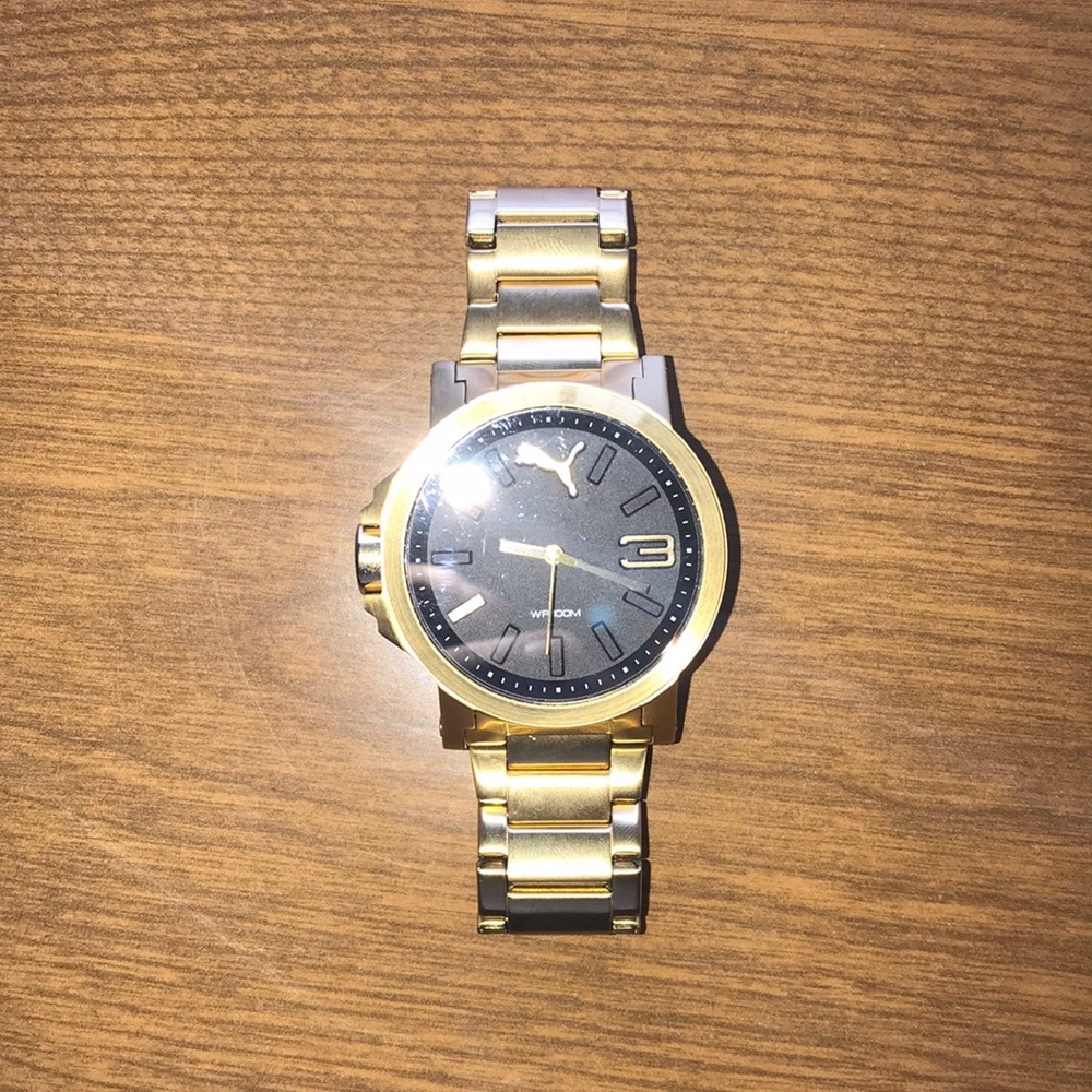 Beautiful black and gold puma watch!